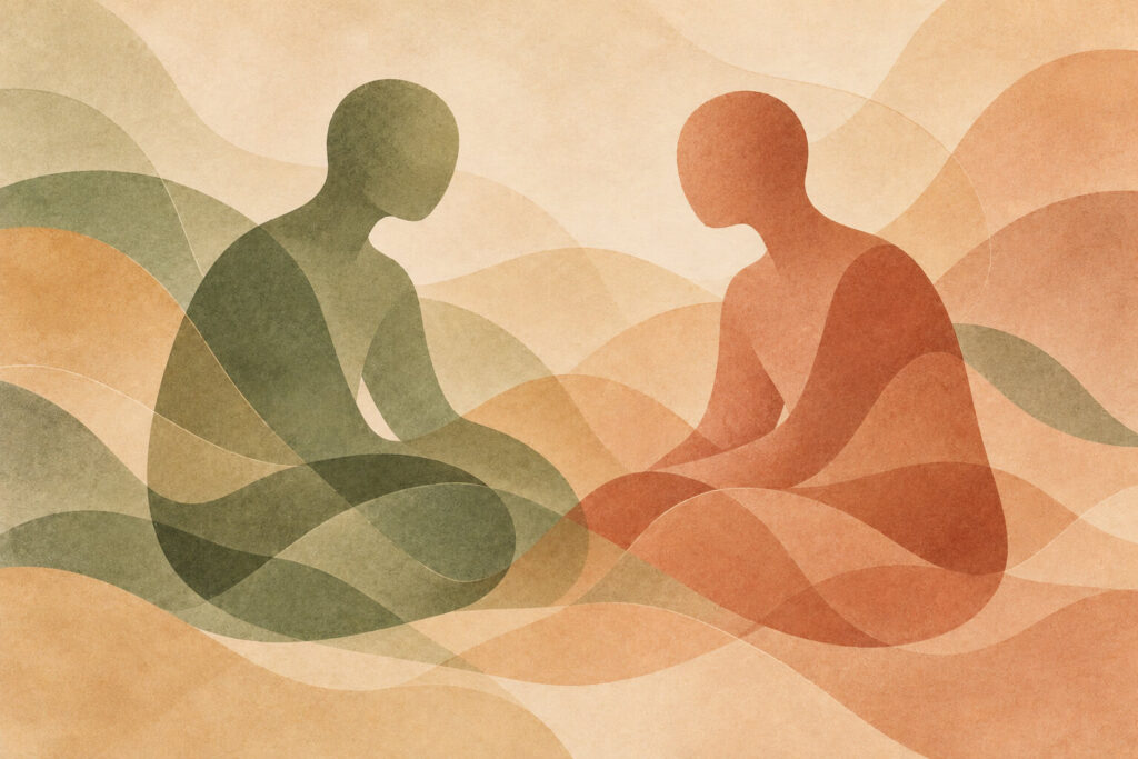Abstract illustration of two seated figures facing one another, representing communication, connection, and couples counseling.
